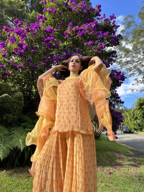 Sonali In our Hand-embroidered Printed Kurta, Printed Sharara with Double Layered Ruffled Dupatta from Retro- Spection Collection